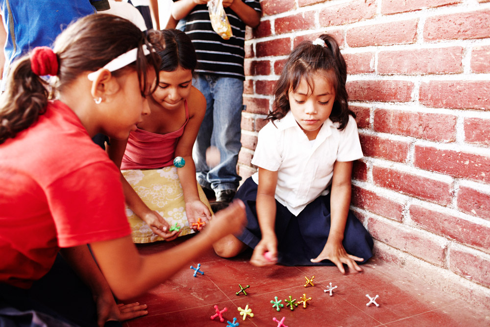 Children Playing Jacks