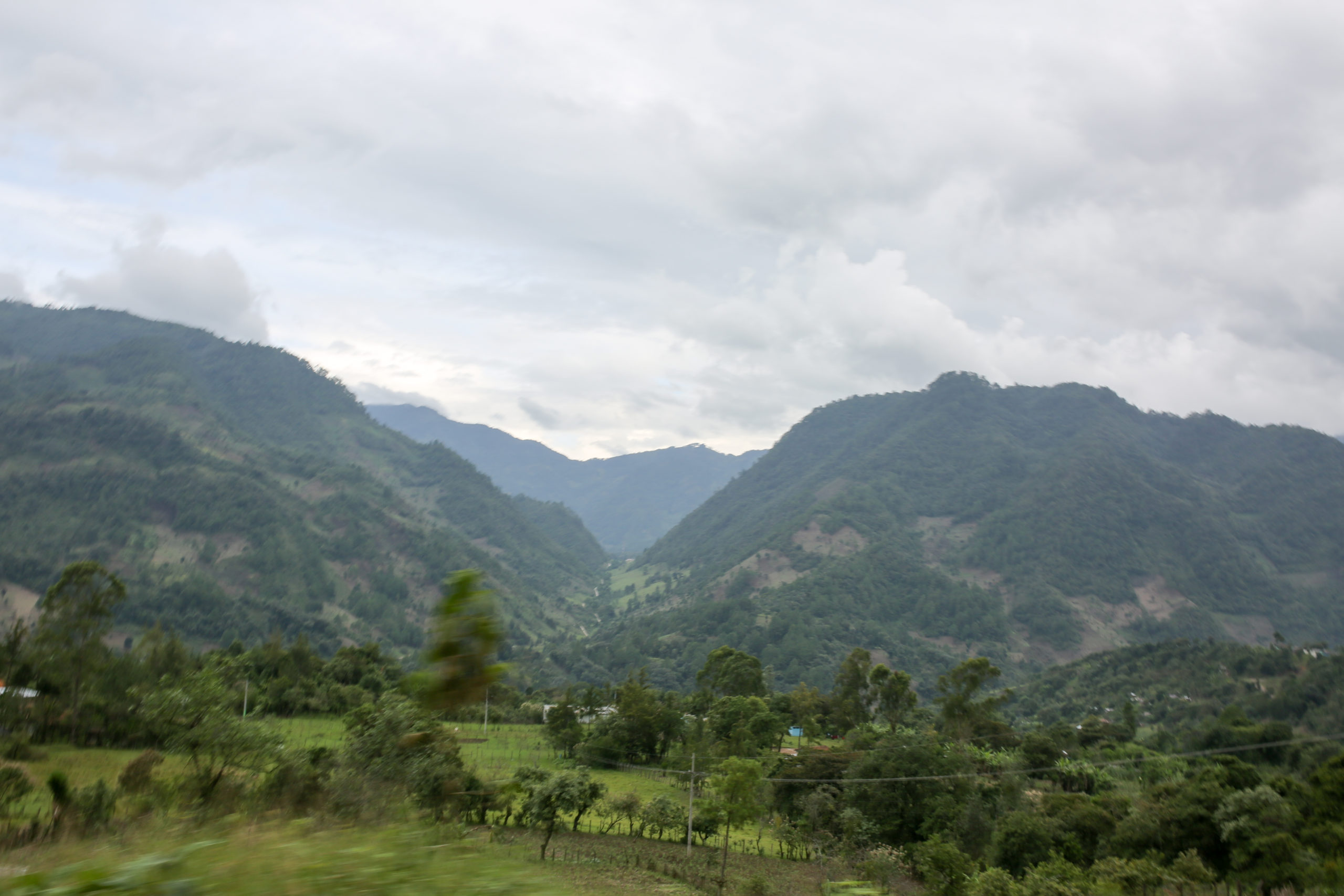 An image of the Guatemalan countryside with mountains in the background
