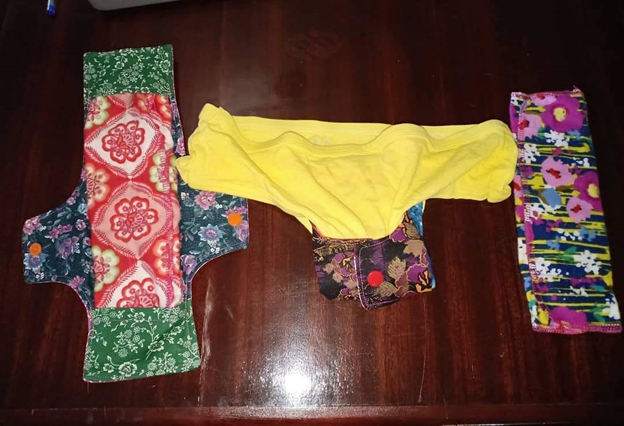 Three individual reusable pads made by the PoP Ghana team