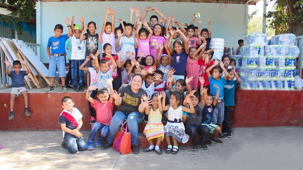 Olga (author) poses with a group of students at a PoP supported school in Guatemala